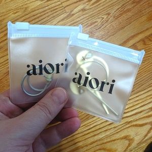 2 sets of Aiori clip-on earrings.